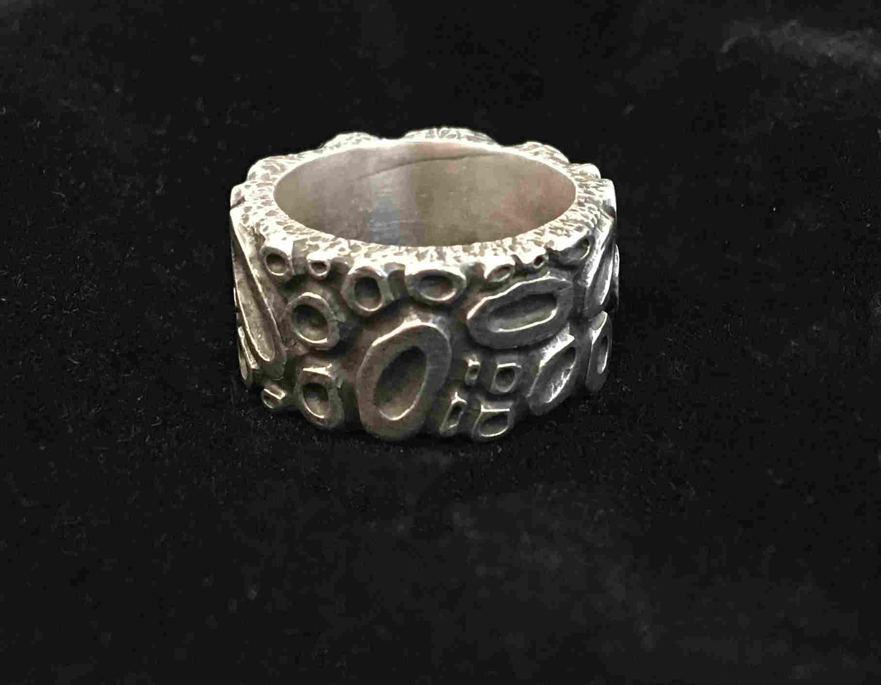 'Broad Sterling Silver Carved Band' by artist Carol Docherty